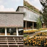 Bangunan modern dengan desain unik, dikelilingi taman bunga marigold cerah dan pepohonan rindang di area publik.